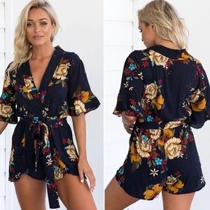 Floral flutter sleeve romper